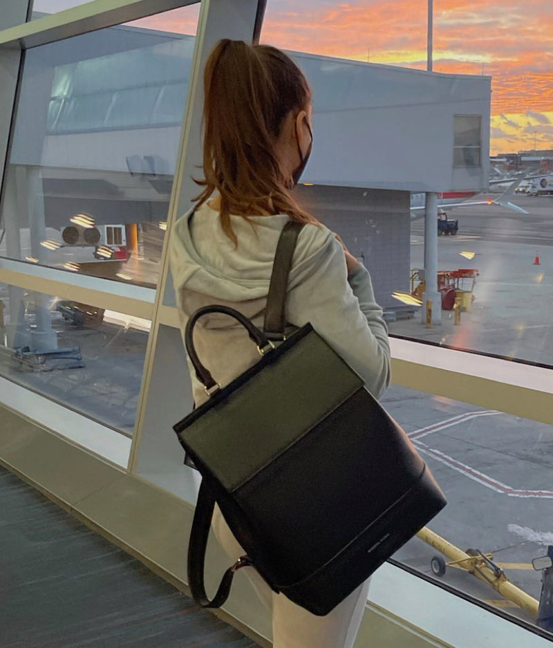 Shoulder, Standing, Luggage and bags, Travel, Bag, Waist, Automotive design, Flooring, Human leg, Shoulder bag