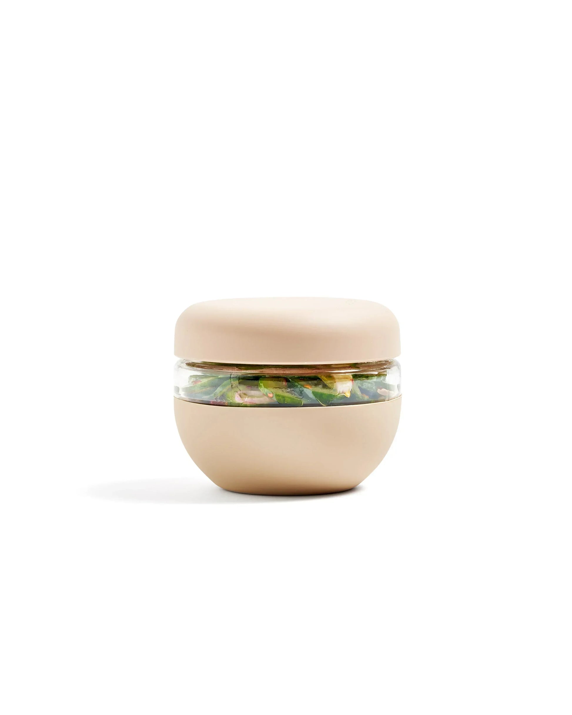 Beige airtight food storage container with clear window, filled with fresh salad.
