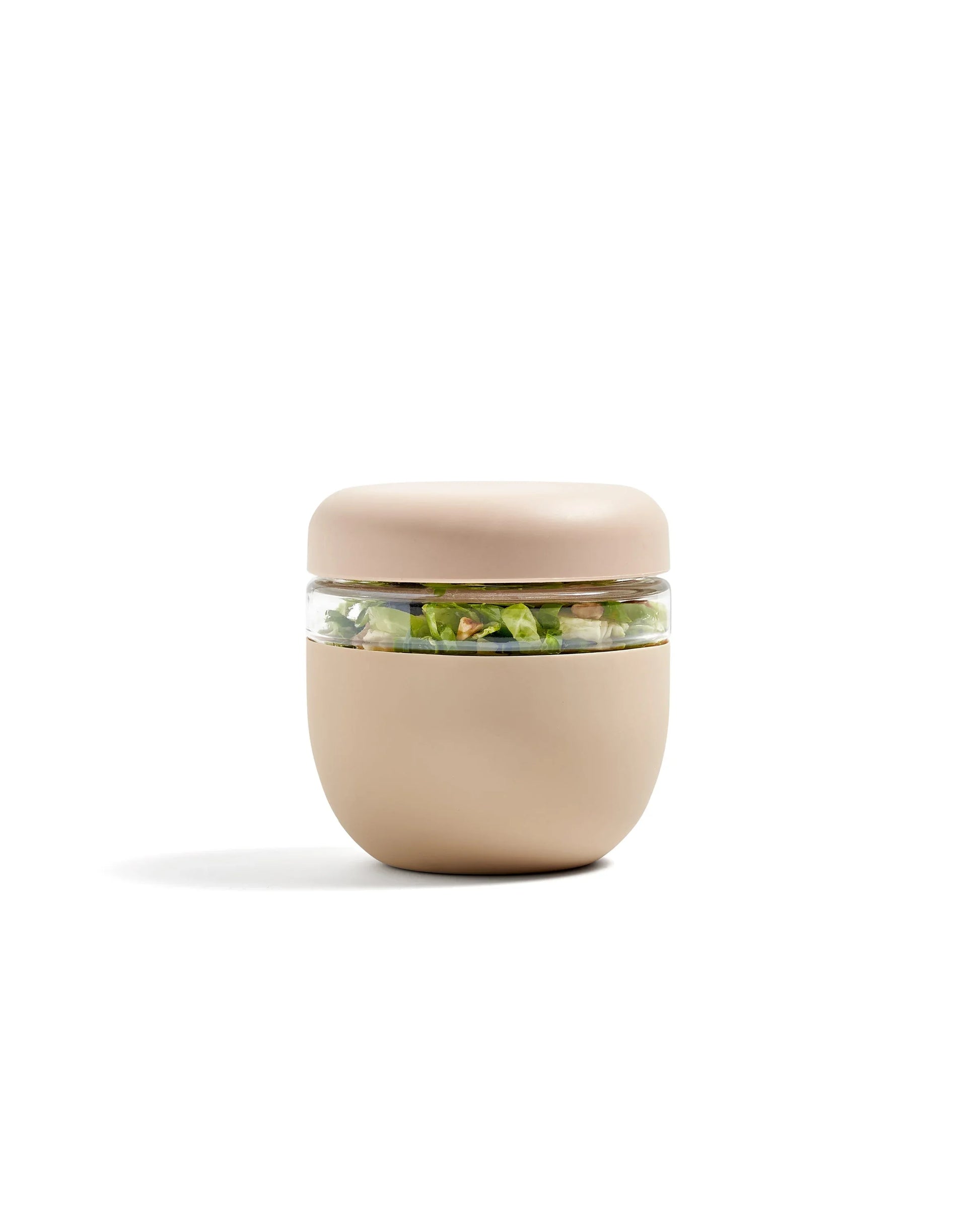 Beige insulated food container with clear window showing salad, on white background