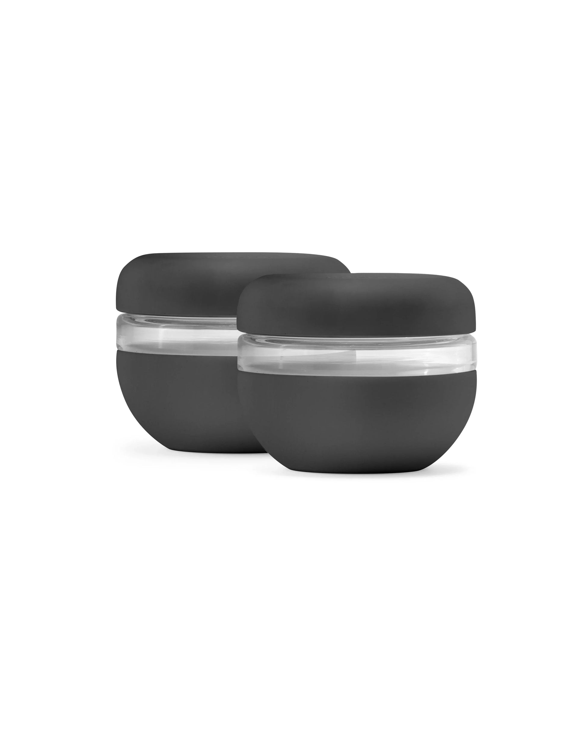 Set of two black leakproof food storage containers with clear lids on white background