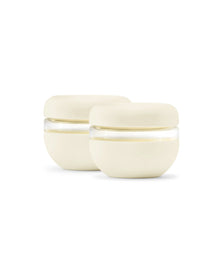 Set of two cream-colored airtight food storage bowls with clear bands on white background.