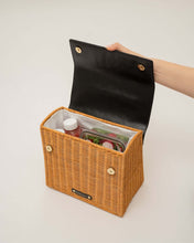 open bag shot of the black wicker caviar luncher showing food inside