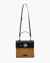 Wicker Luncher with black top section and wicker bottom on a white background