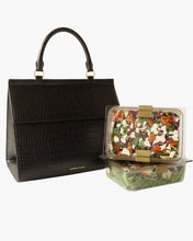 Black large luncher bag with two reusable food containers filled with salad and fruit