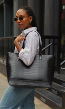 Woman carrying the Modern Picnic Bigger The Better Set — black tote and croc bag — styled for everyday city wear.