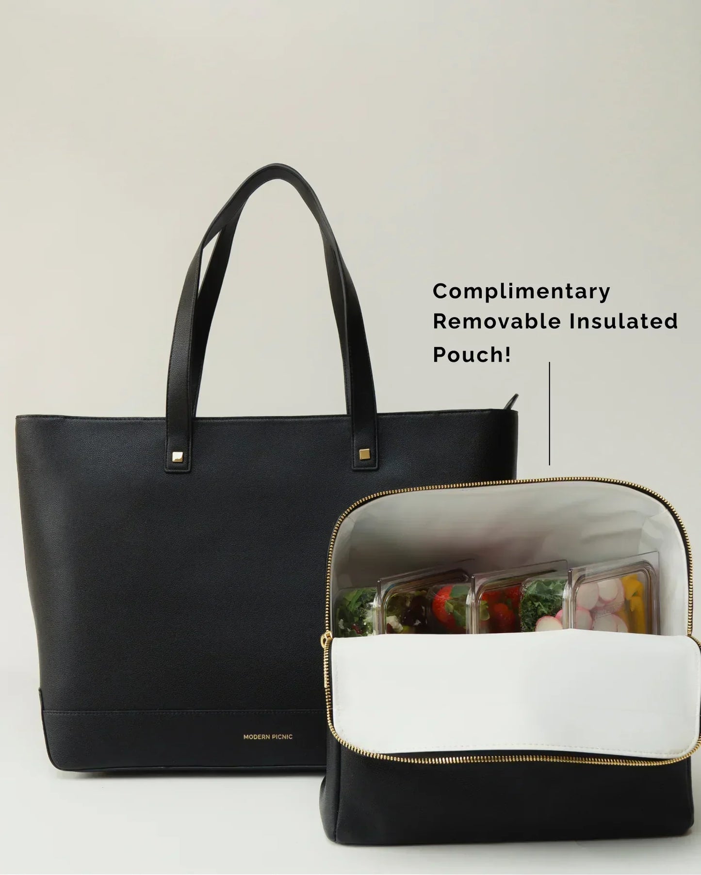 Modern Picnic black pebble tote bag shown with removable insulated pouch filled with snacks and drinks