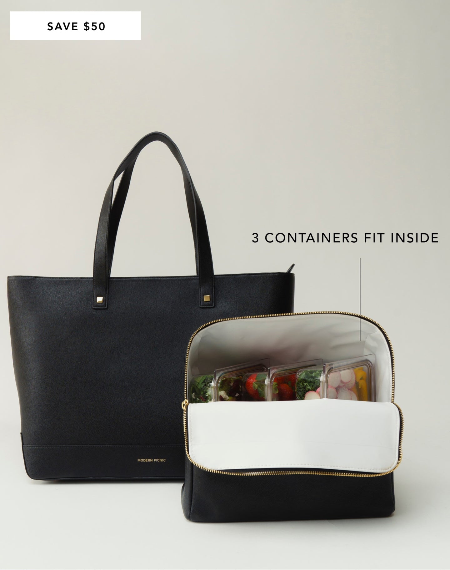 Modern Picnic black tote bag with three stackable food containers shown inside the insulated interior.