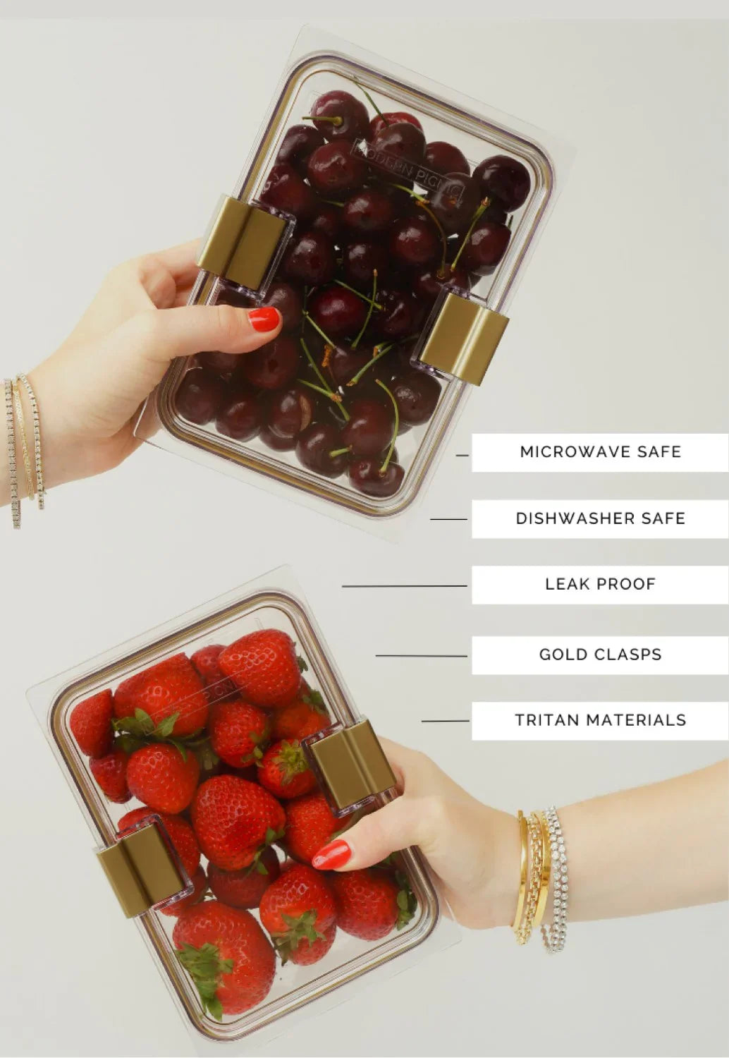 Person holding two Modern Picnic glass containers filled with strawberries and cherries.