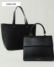 Two black handbags, one with a smooth finish and the other with a crocodile pattern. Both have handles and are displayed against a white background.