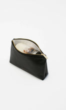 Open view of the Modern Picnic black pouch from THE SNACKER SET showing spacious interior filled with snacks and small essentials.