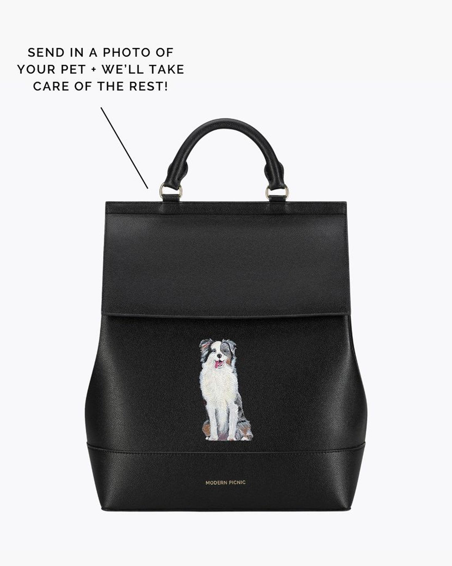 A black vegan leather backpack with a custom painted pet portrait on the front. The handle is visible at the top, and the backpack is designed to carry a laptop in a padded sleeve.