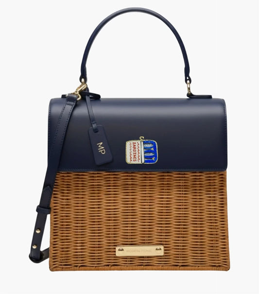 Navy blue and wicker tote with sardine can patch, vegan leather, and gold hardware for stylish picnics