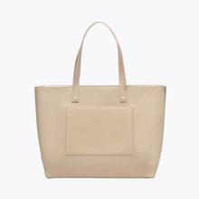 A back-facing studio shot of a large cream tote bag with two shoulder straps. The back panel features a stitched-in slip pocket.