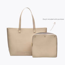 A studio shot showing a large cream tote bag next to a matching cream zippered pouch. The pouch is included with the purchase. The tote has a subtle "MODERN PICNIC" logo near the bottom.