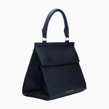Side view of Modern Picnic black luncher bag showing structured silhouette and gold hardware.