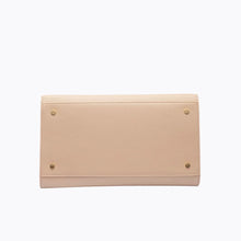 Bottom view of cream personalized handbag with gold stud feet